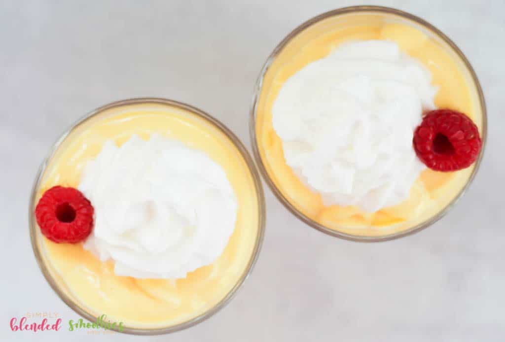 Mango Peach Milkshake 2 milkshake with whipped cream on top made with magos and peaches