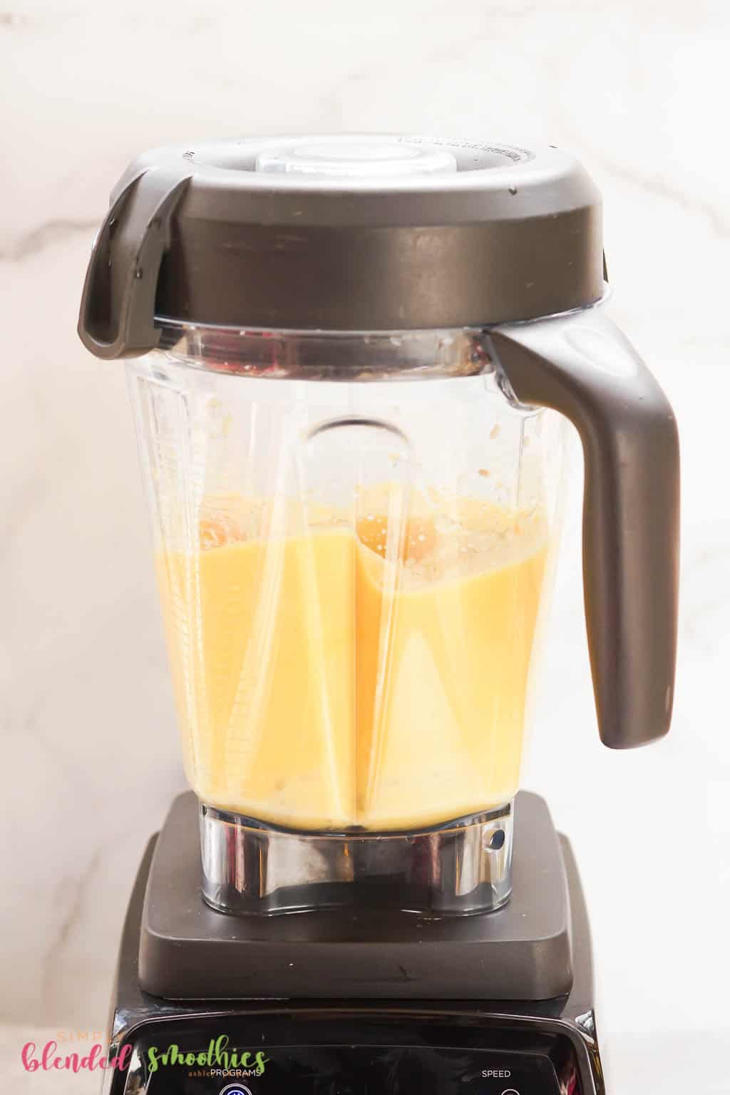 3 Ingredient Mango Pineapple Smoothie 10 tropical smoothie ingredients being blended in a blender
