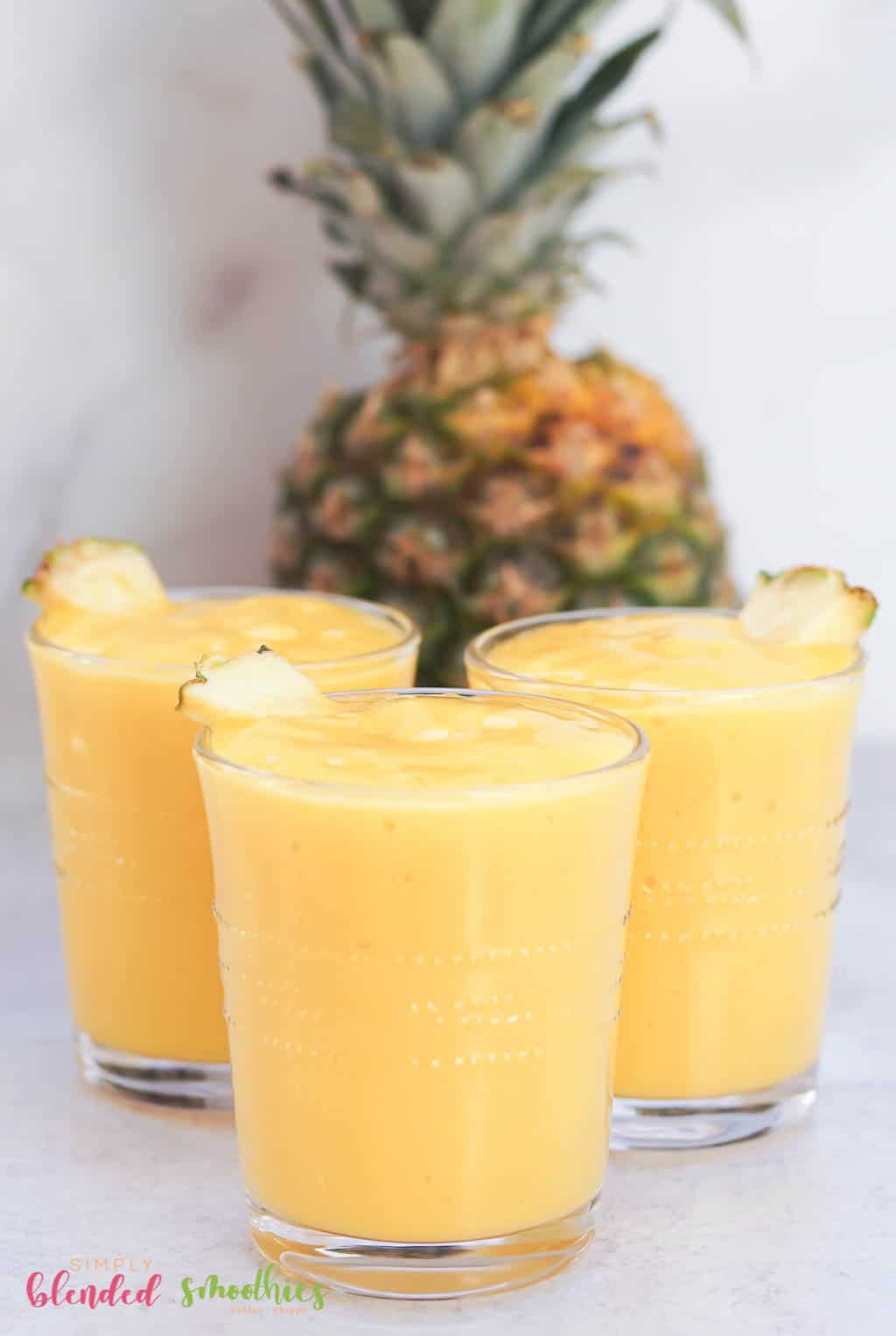 Mango Peach Smoothie 14 Mango Pineapple Smoothie with pineapple in background