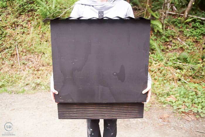 woman holding a diy bat house