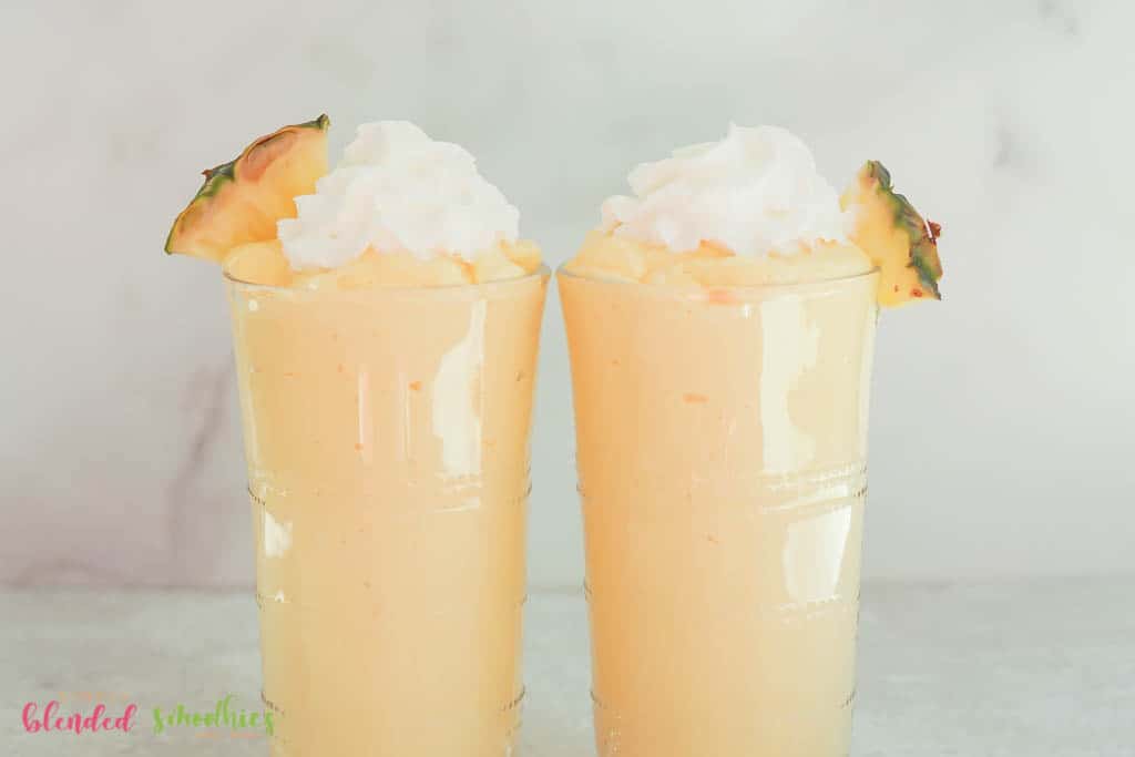 Mango Pineapple Milkshake 4 two mango pineapple milkshakes vertical photo