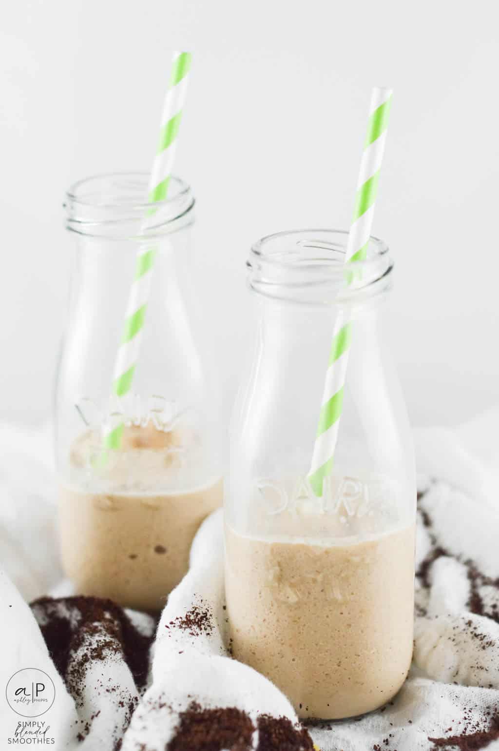 Coffee Smoothie 13 two glasses with coffee smoothie in them half full with straw