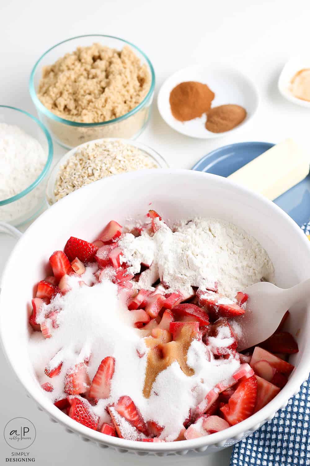 add sugar, flour, lemon juice, and vanilla onto strawberries and rhubarb