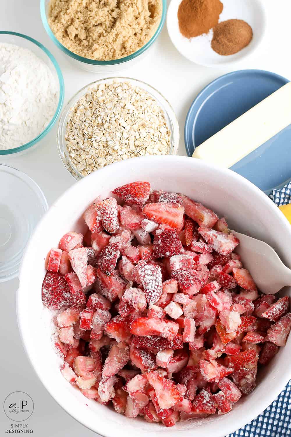 mix sugar, flour, lemon juice, vanilla, strawberries and rhubarb together