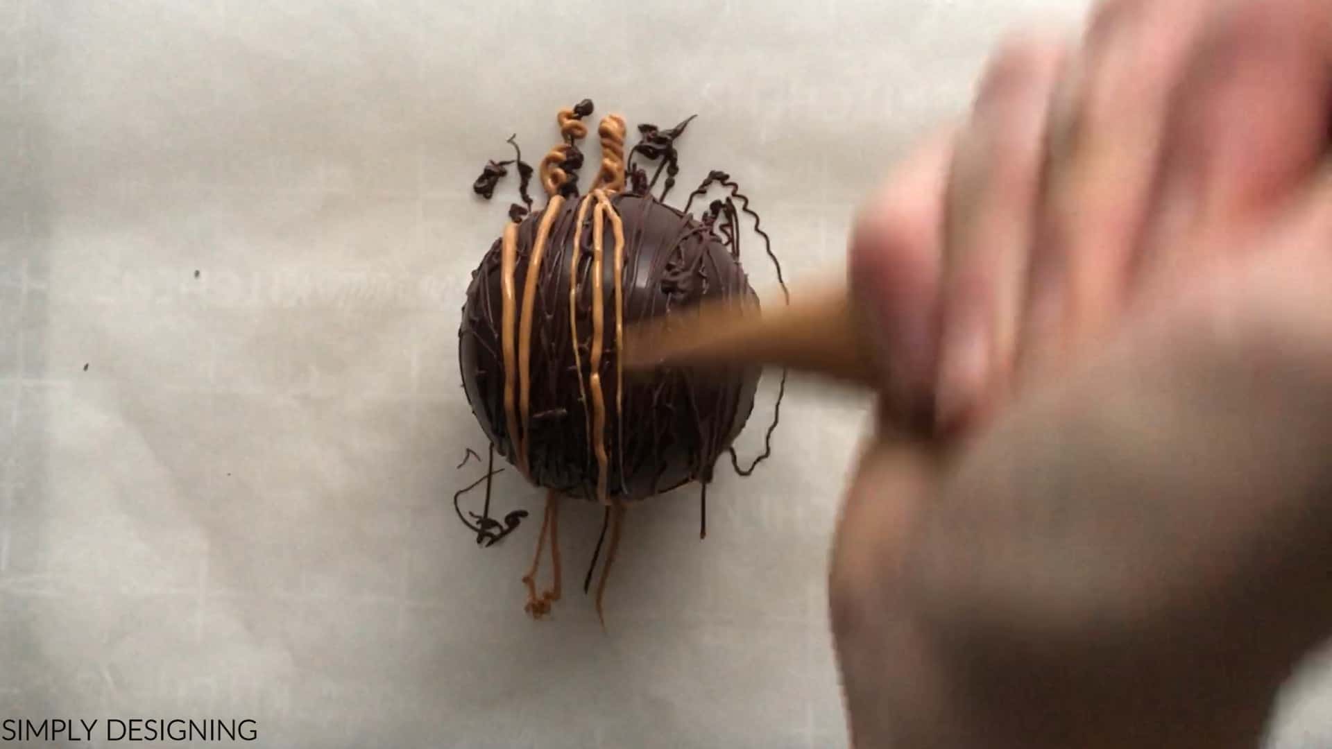 add salted caramel candy melts for caramel chocolate bomb decoration