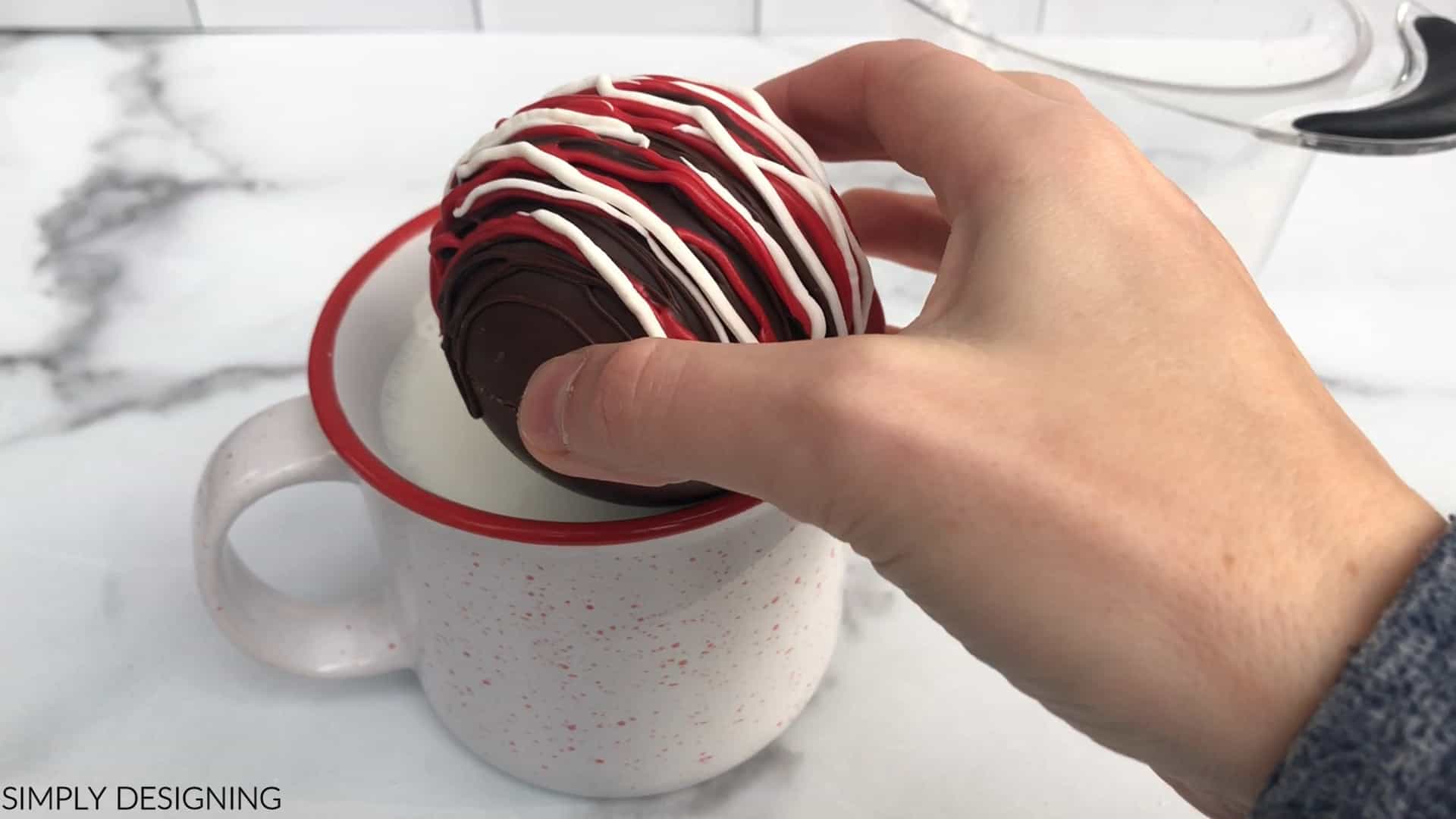 add peppermint hot chocolate bomb to hot milk in mug