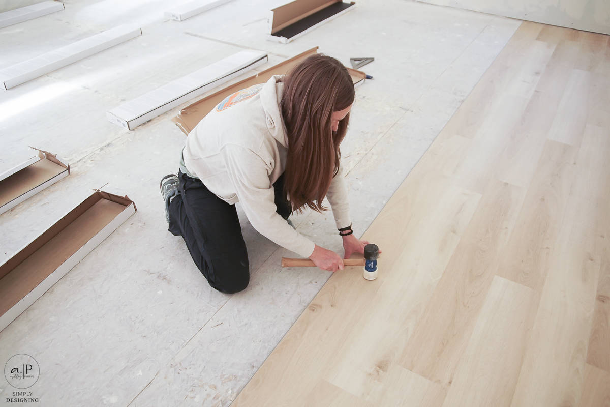 use a mallet to gently tap lvp flooring into place